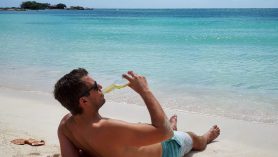 man drinking beer Aruba